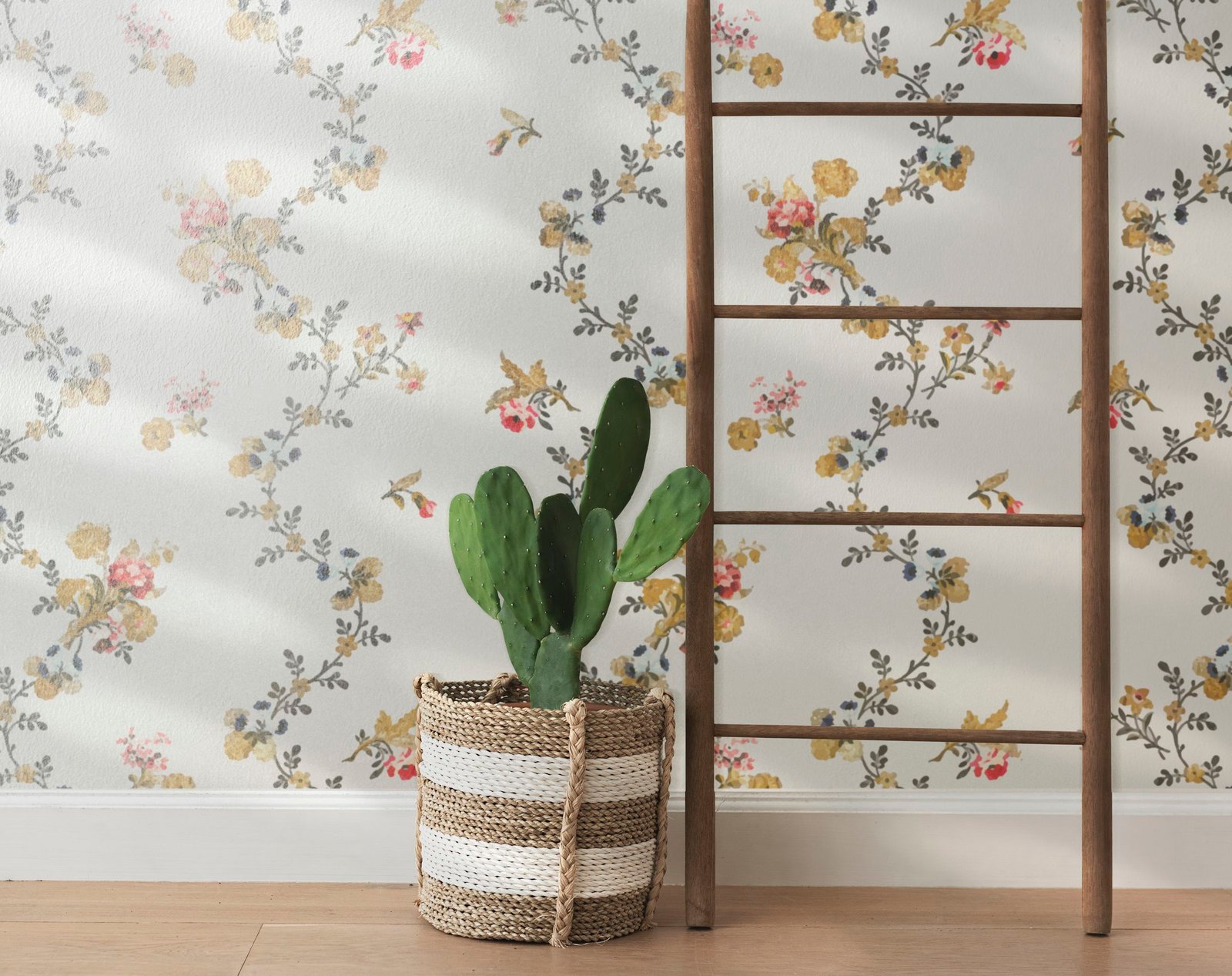 Rattan basket by a floral wall background
